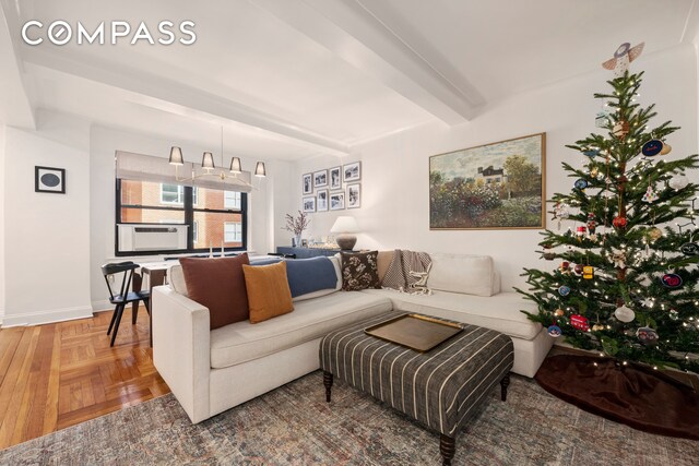 living room featuring parquet floors, beam ceiling, and cooling unit