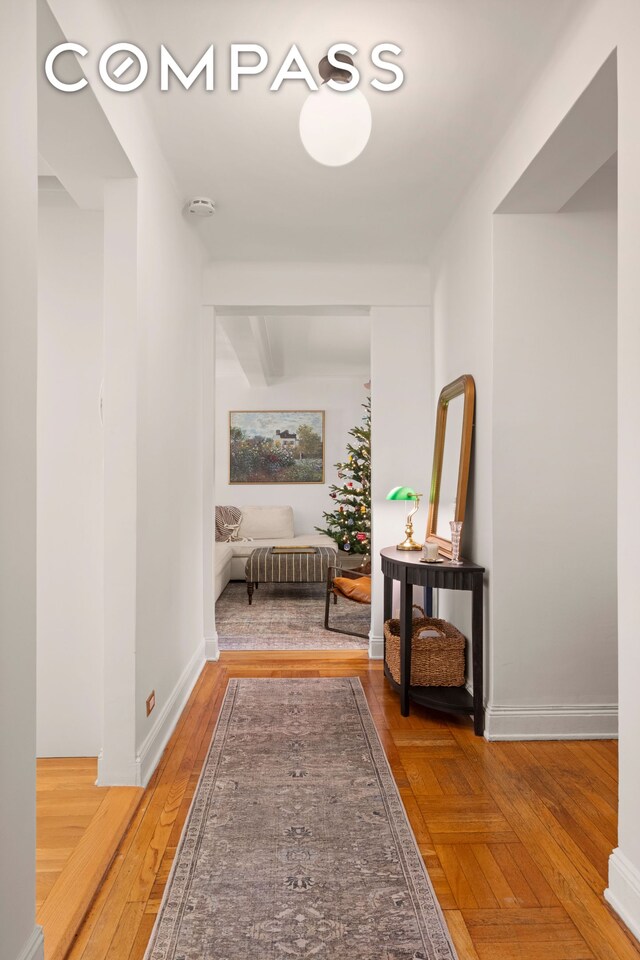 corridor featuring hardwood / wood-style floors