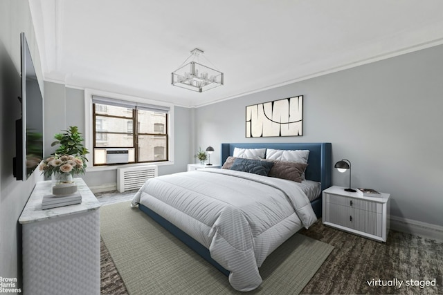 bedroom with ornamental molding and a chandelier