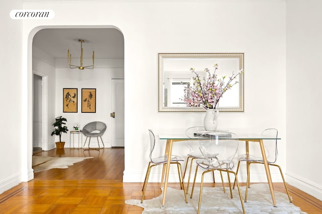 dining room featuring parquet floors