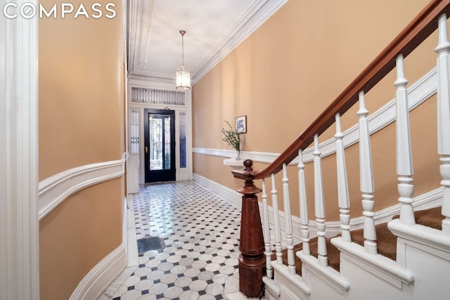 entryway with crown molding