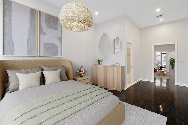 living room featuring a skylight, dark wood-type flooring, a baseboard radiator, and electric panel