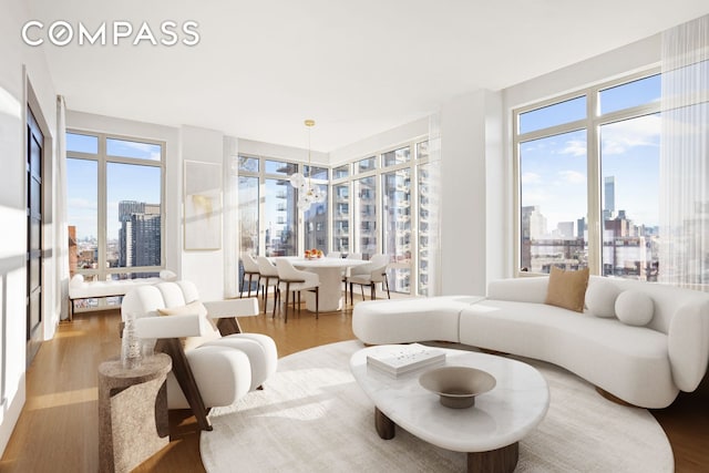 living room with a city view and wood finished floors