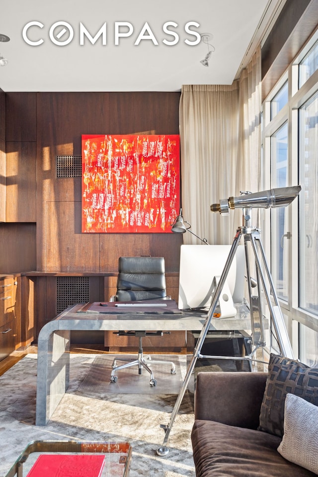 home office featuring wood walls