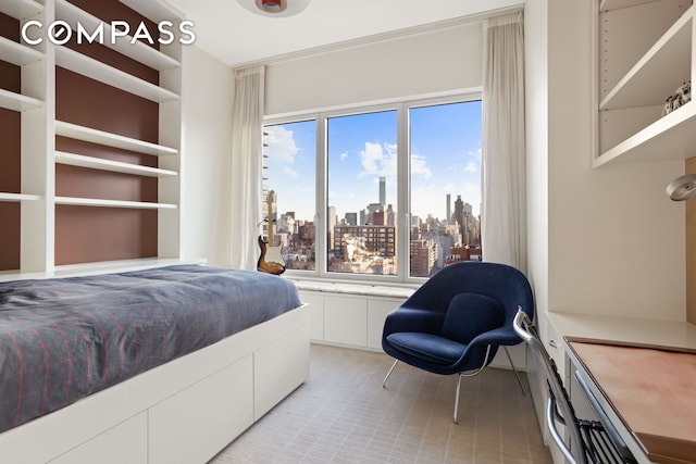 bedroom featuring a city view