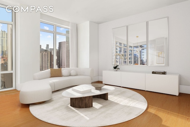 living room with a view of city and wood finished floors