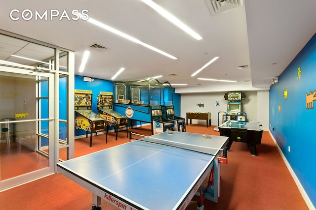 playroom featuring carpet floors, baseboards, and visible vents