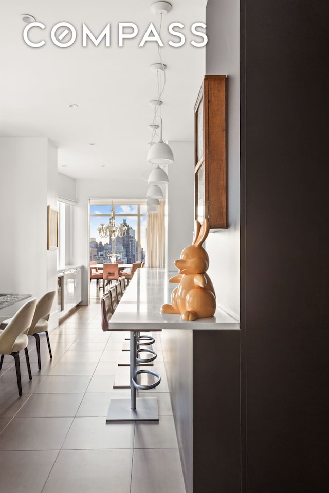 hall featuring light tile patterned floors