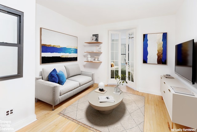 living room with light hardwood / wood-style flooring