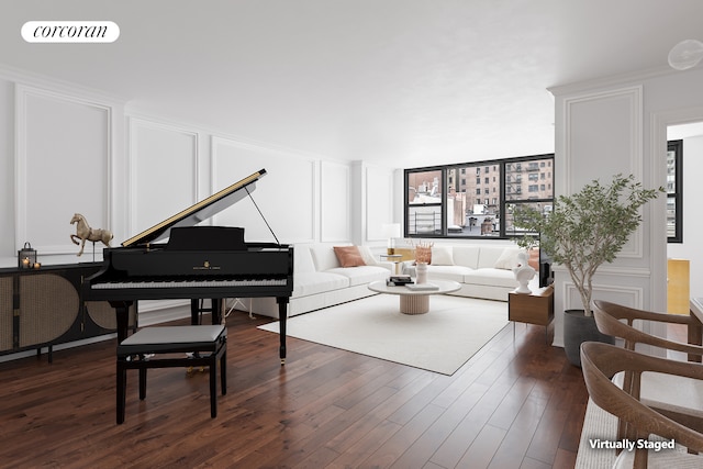 living room with dark wood-style floors, a decorative wall, and visible vents