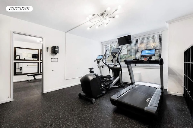 exercise room featuring a notable chandelier, baseboards, and visible vents