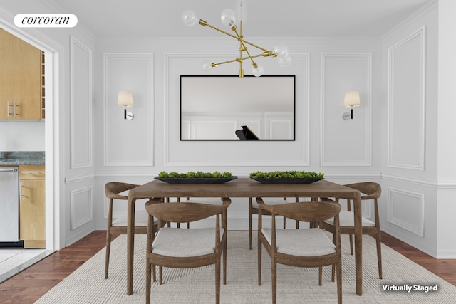 dining area with wood-type flooring, crown molding, an inviting chandelier, and breakfast area