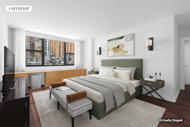 bedroom featuring wood finished floors, visible vents, and baseboards