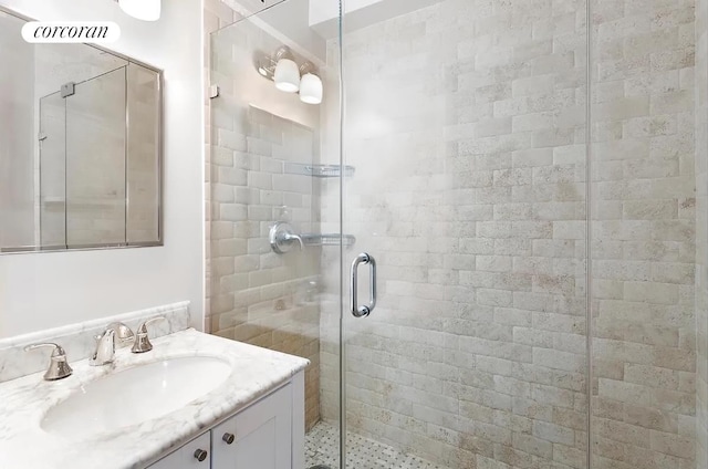 bathroom featuring visible vents, a shower stall, and vanity