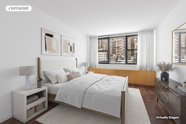 bedroom featuring dark wood-style floors and visible vents