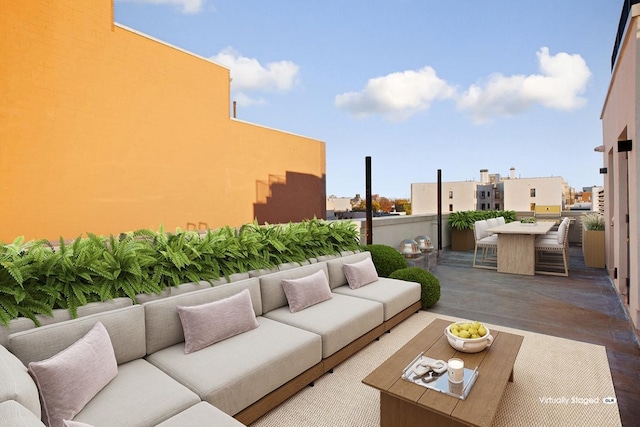 view of patio / terrace featuring a bar and an outdoor hangout area