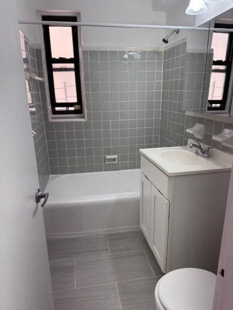 3400 Snyder Ave Unit 5E, New York City, NY 11203 - bathroom featuring toilet, tile patterned flooring, vanity, and plenty of natural light