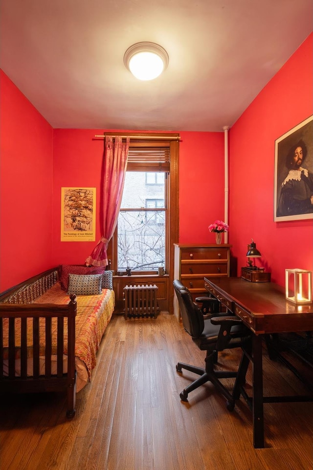 25 W 71st St Unit 1R, New York City, NY 10023 - bedroom with radiator heating unit and hardwood / wood-style floors