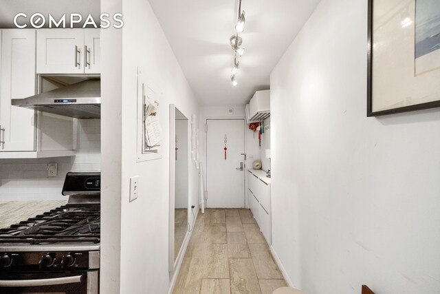 bedroom featuring wood-type flooring and radiator heating unit