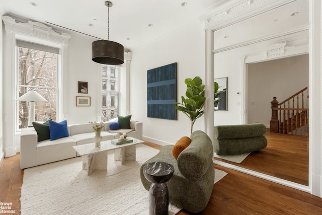 interior space featuring crown molding and hardwood / wood-style floors