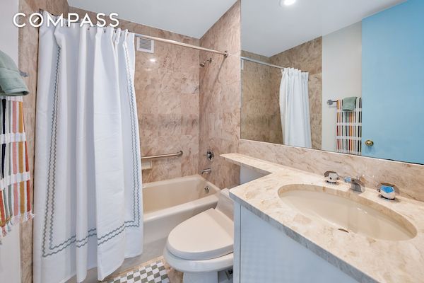 full bathroom featuring vanity, toilet, and shower / bath combo with shower curtain