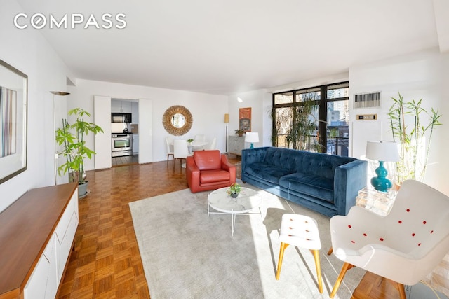 living room with dark parquet floors