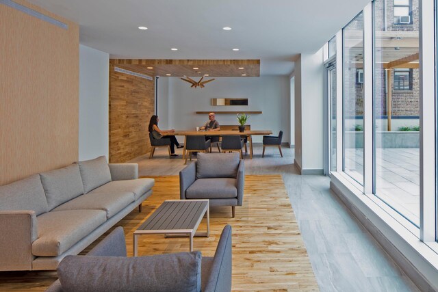 285 W 110th St Unit 2A, New York City, NY 10026 - living area with wood finished floors, recessed lighting, and wallpapered walls