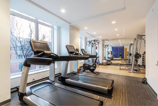 285 W 110th St Unit 2A, New York City, NY 10026 - workout area with healthy amount of natural light, baseboards, recessed lighting, and carpet floors