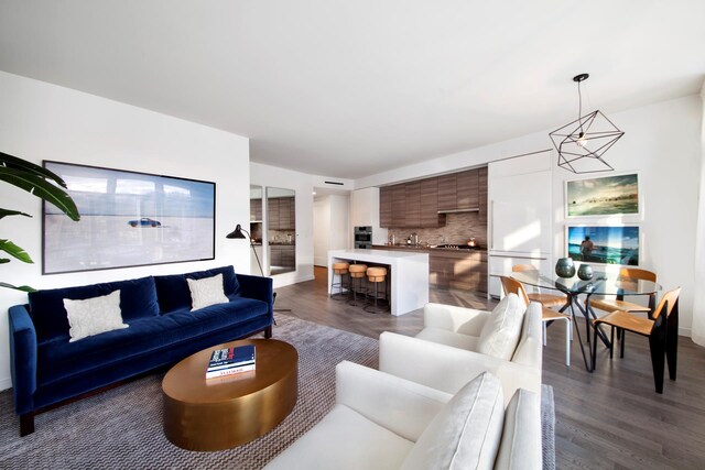 285 W 110th St Unit 2A, New York City, NY 10026 - living area featuring dark wood-style floors and baseboards