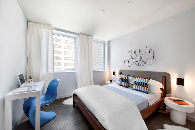 285 W 110th St Unit 2A, New York City, NY 10026 - bedroom featuring wood finished floors and baseboards
