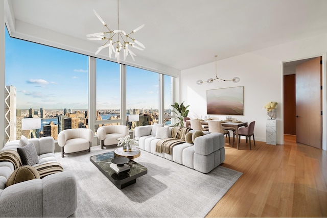 living area featuring a city view, expansive windows, an inviting chandelier, and wood finished floors