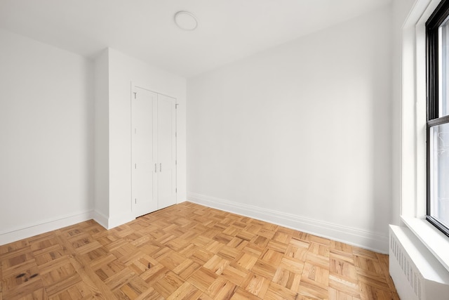 interior space featuring radiator heating unit and baseboards