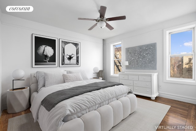 bedroom featuring ceiling fan and dark hardwood / wood-style flooring