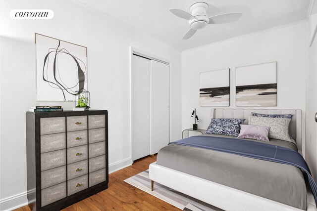 bedroom featuring hardwood / wood-style floors, a closet, and ceiling fan