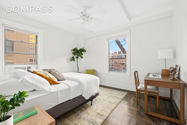 bedroom featuring ceiling fan and baseboards