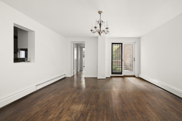 spare room with an inviting chandelier, baseboards, baseboard heating, and hardwood / wood-style flooring