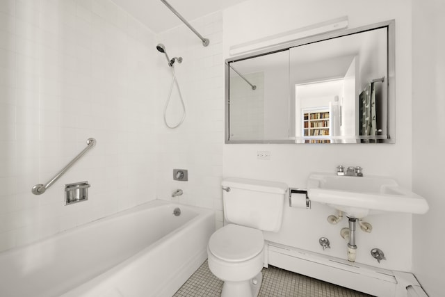 full bathroom featuring bathtub / shower combination, toilet, and tile patterned floors