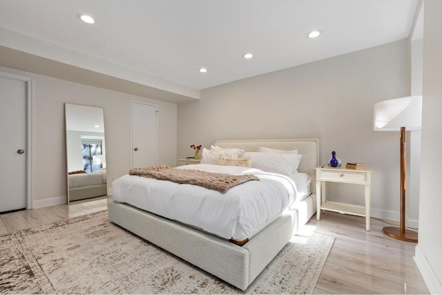 bedroom with light hardwood / wood-style floors