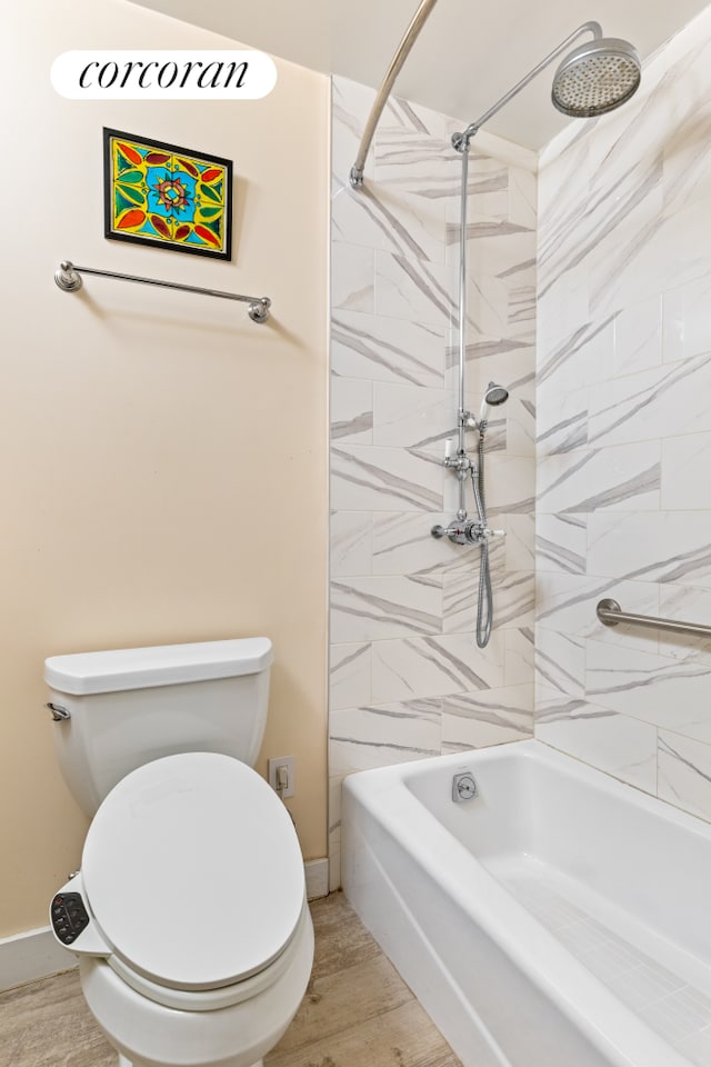 300 Rector Pl Unit 8Lm, New York City, NY 10280 - bathroom with toilet, washtub / shower combination, wood finished floors, and baseboards