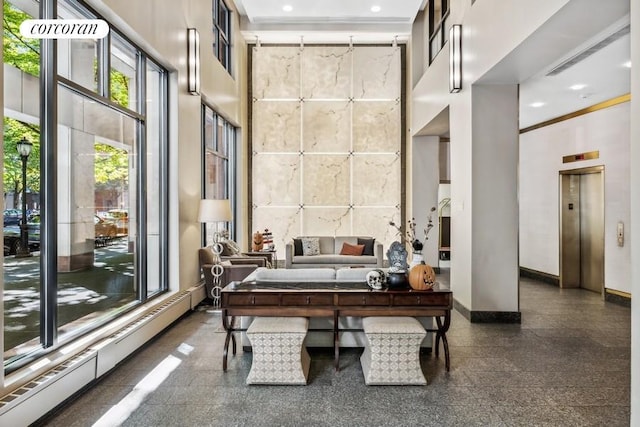 300 Rector Pl Unit 8Lm, New York City, NY 10280 - office with elevator, a towering ceiling, a baseboard heating unit, recessed lighting, and granite floors