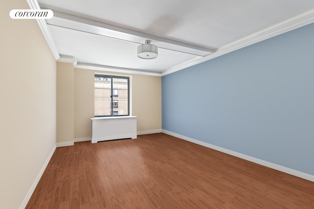 unfurnished room with crown molding, wood-type flooring, and beamed ceiling