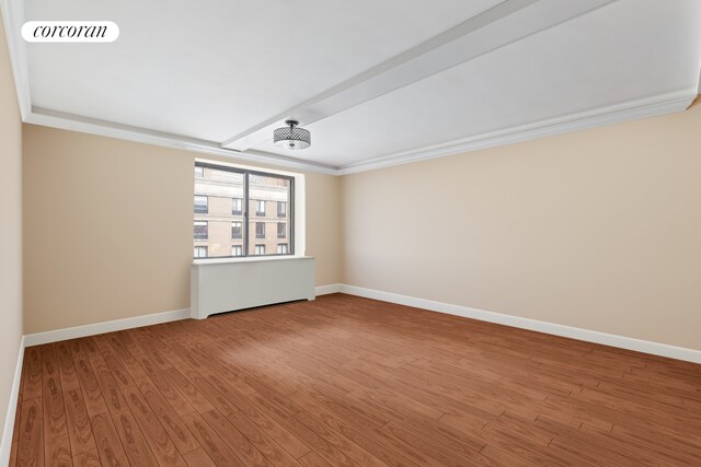 bedroom featuring crown molding and light hardwood / wood-style flooring