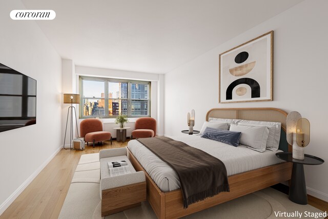 bedroom featuring light wood-type flooring