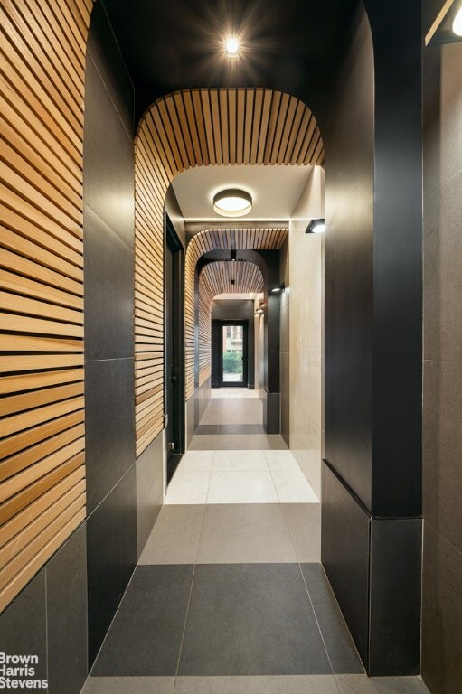 corridor with tile patterned flooring