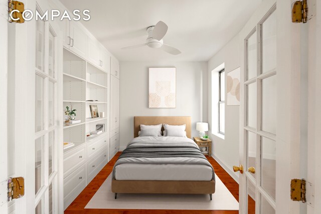 bedroom with dark wood-type flooring, french doors, a ceiling fan, and baseboards