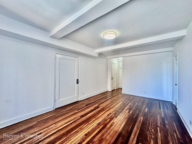 interior space featuring baseboards and wood finished floors