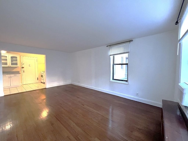 spare room with hardwood / wood-style flooring