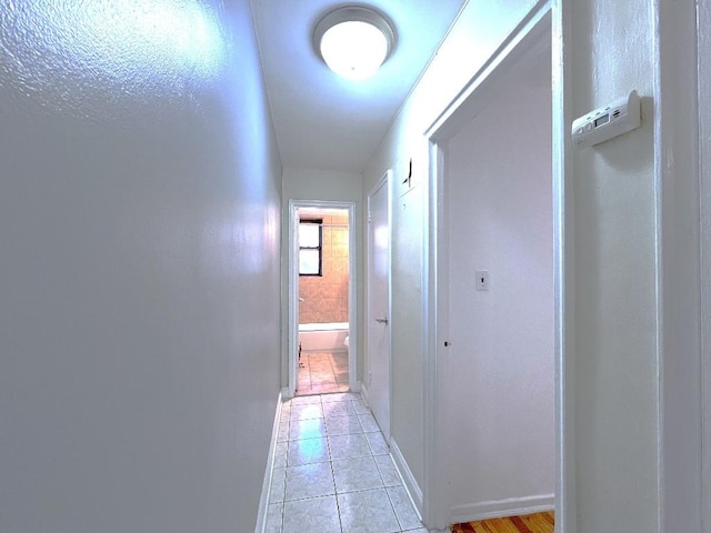 corridor featuring light tile patterned flooring