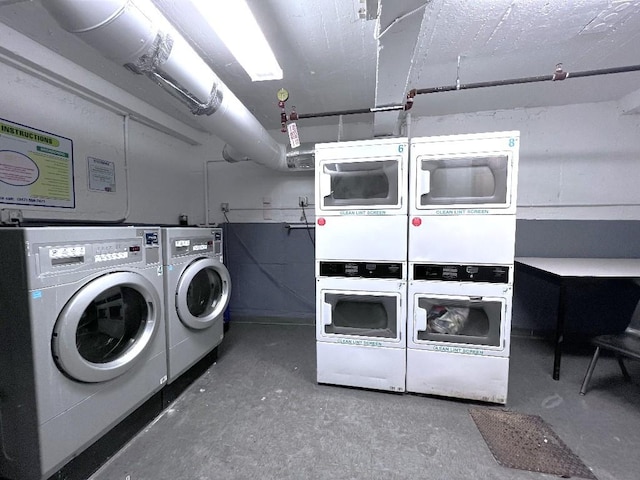 washroom with stacked washer / drying machine and washing machine and clothes dryer