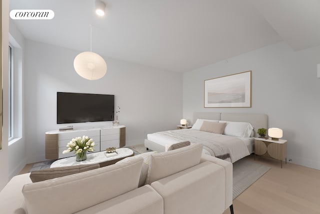 208 Delancey St Unit 1A, New York City, NY 10002 - bedroom featuring light wood-type flooring and baseboards
